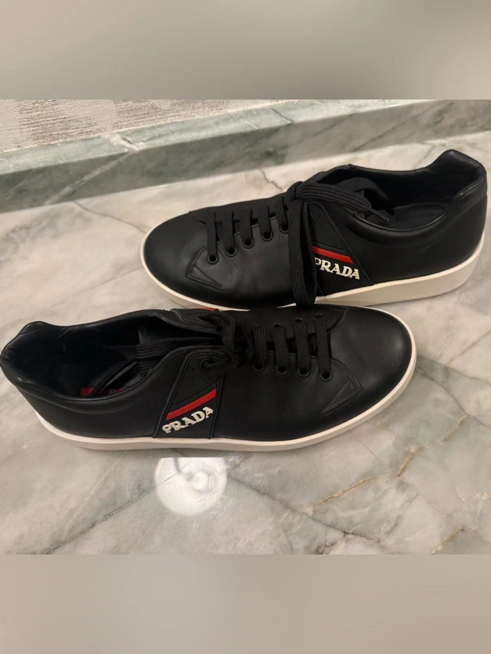 Prada Black Leather Sneakers with Red Stripe and White Sole